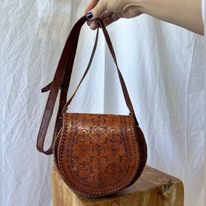 Vintage Brown Tooled Leather Round Crossbody Bag with Snap Closure
